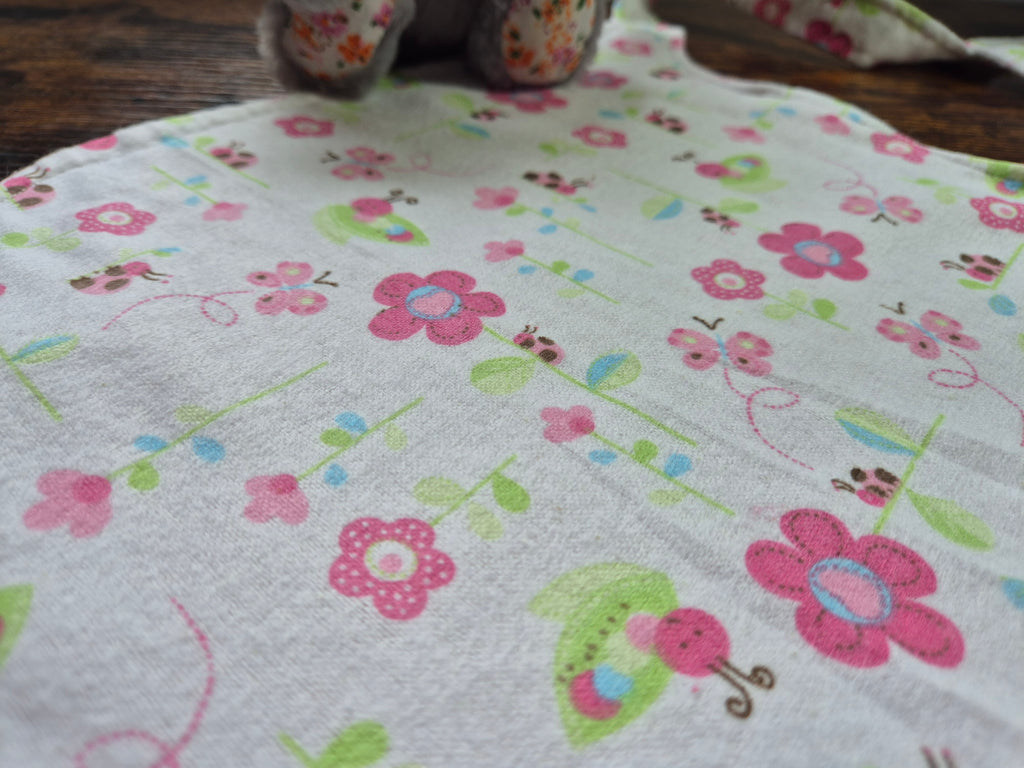 close up of fabric print for nom nom adult baby bib