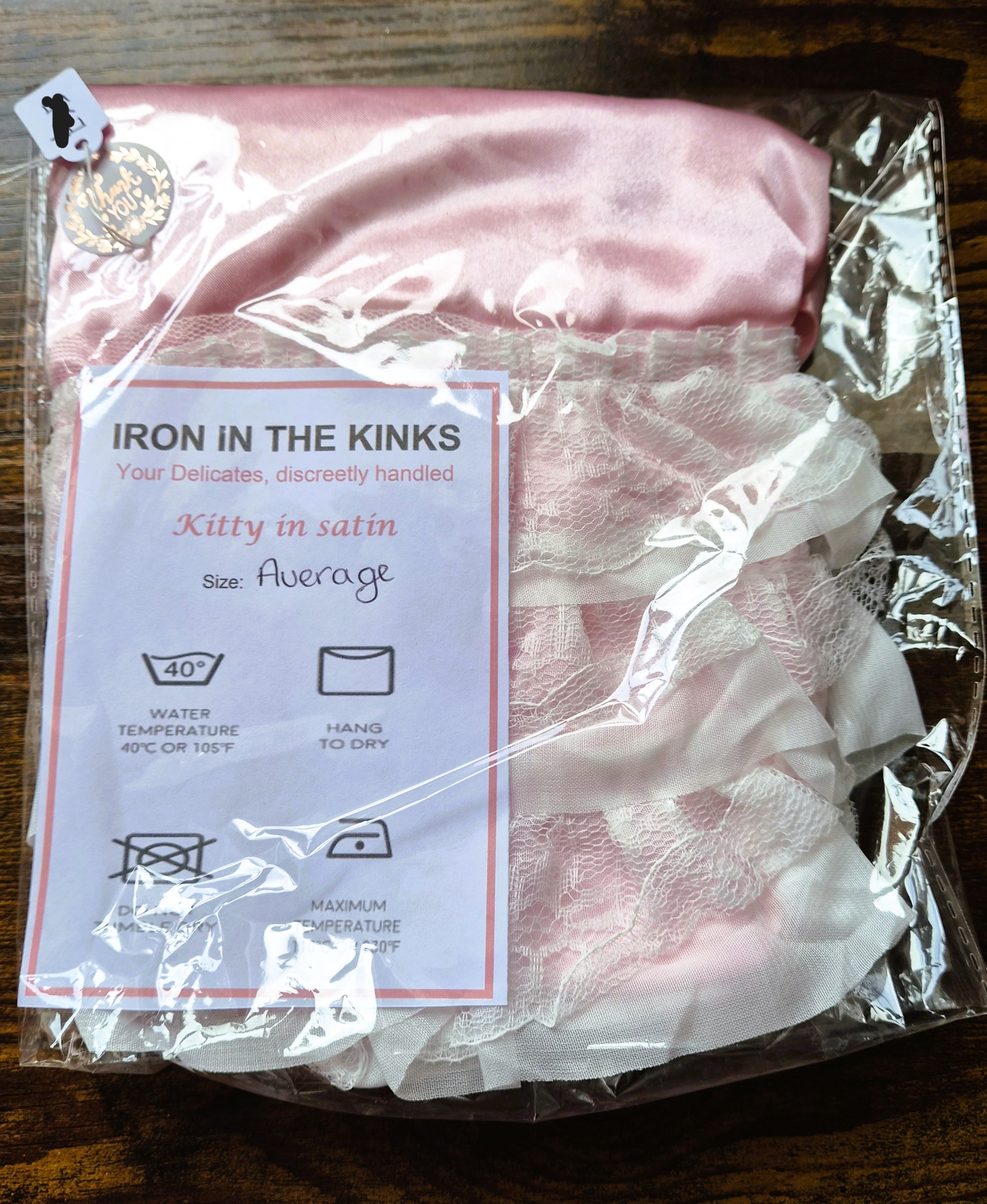 Pink satin panties with white double layer lace across the back