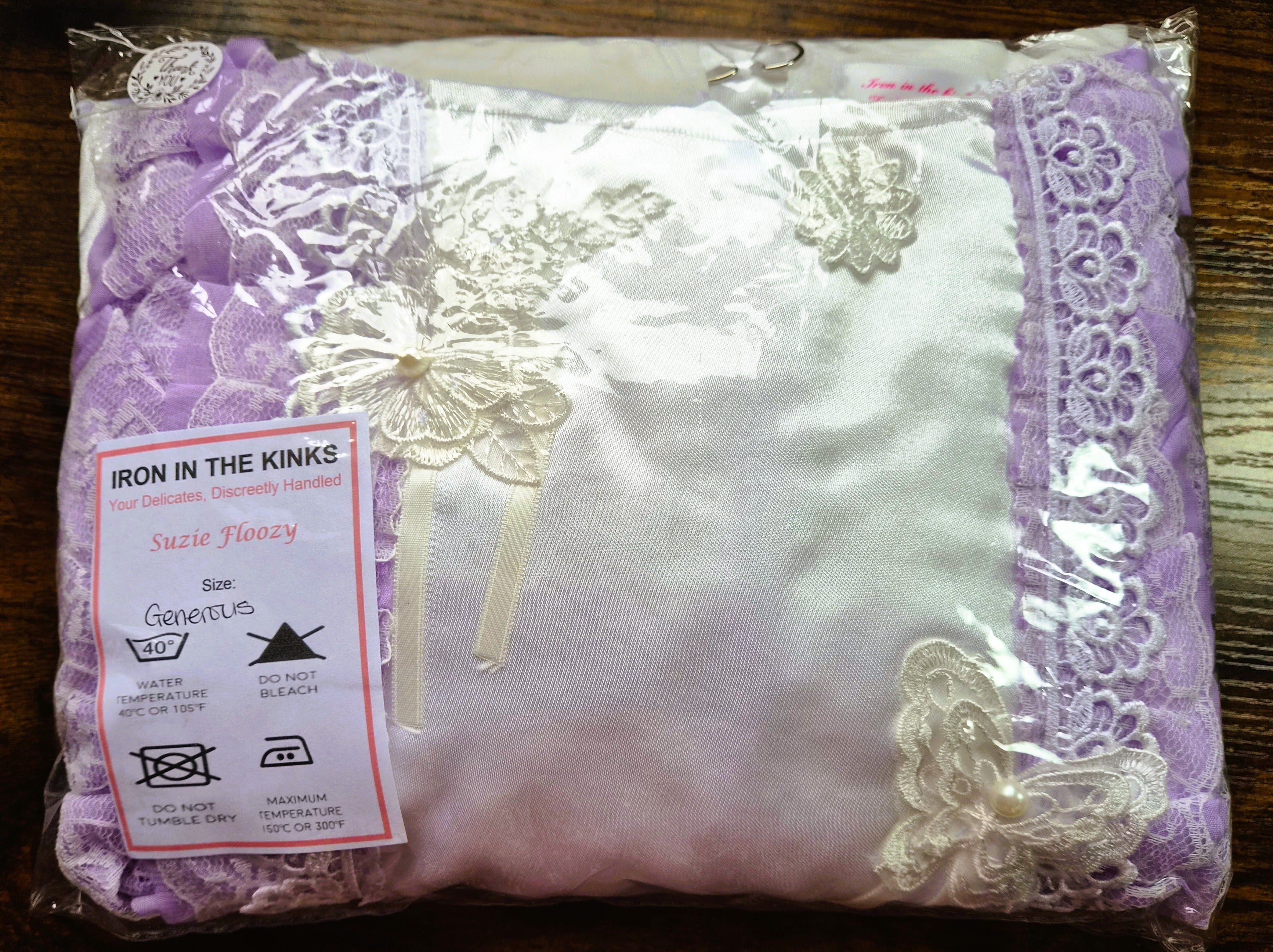 White satin sissy/adult baby dress with purple ribbon and white accents. 
