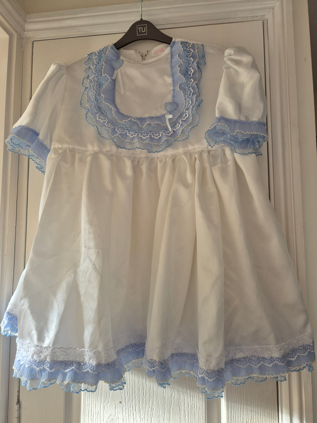 White satin sissy/adult baby dress with blue ruffles and accents. 