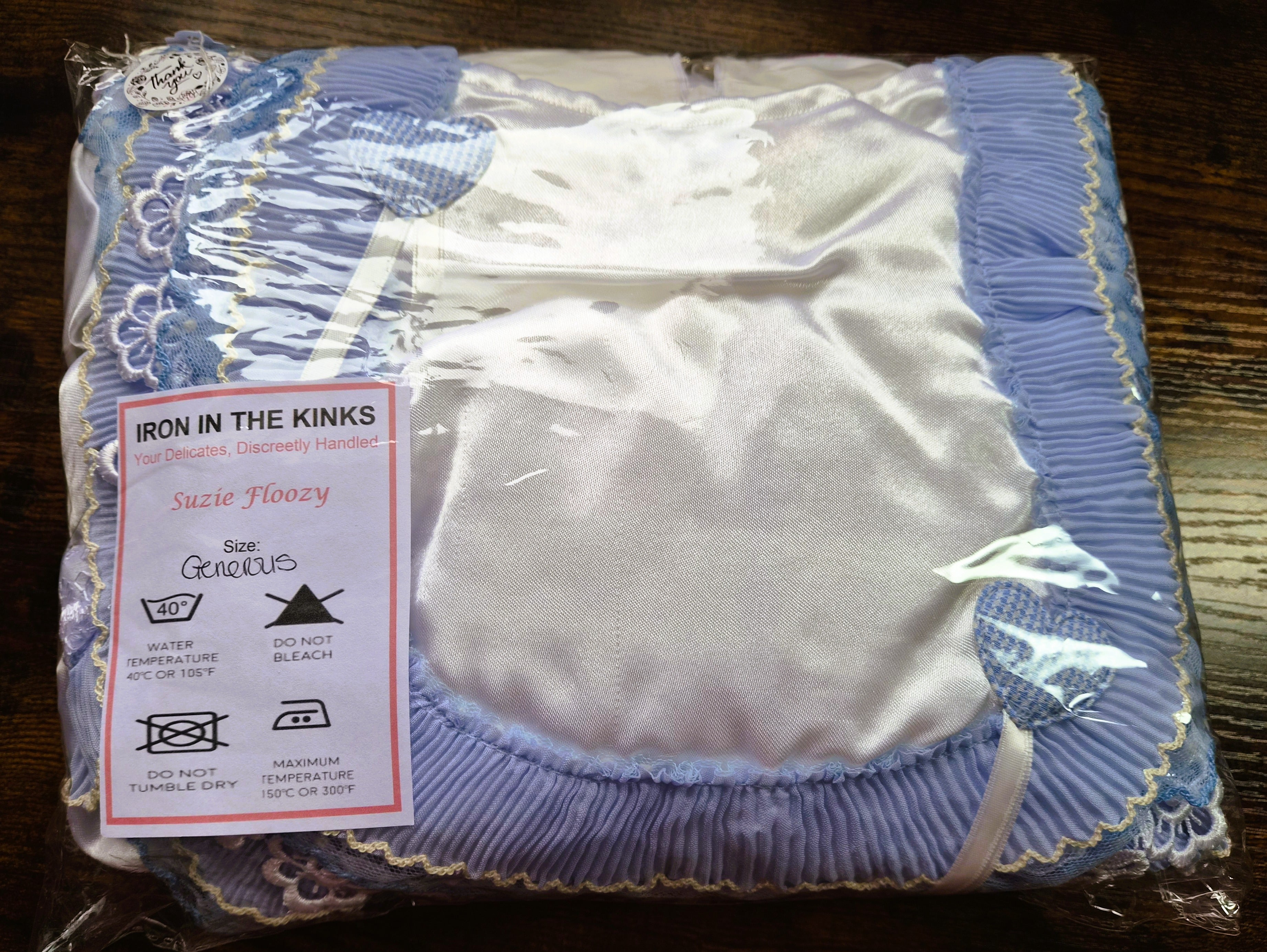 White satin sissy/adult baby dress with blue ribbon and accents. 