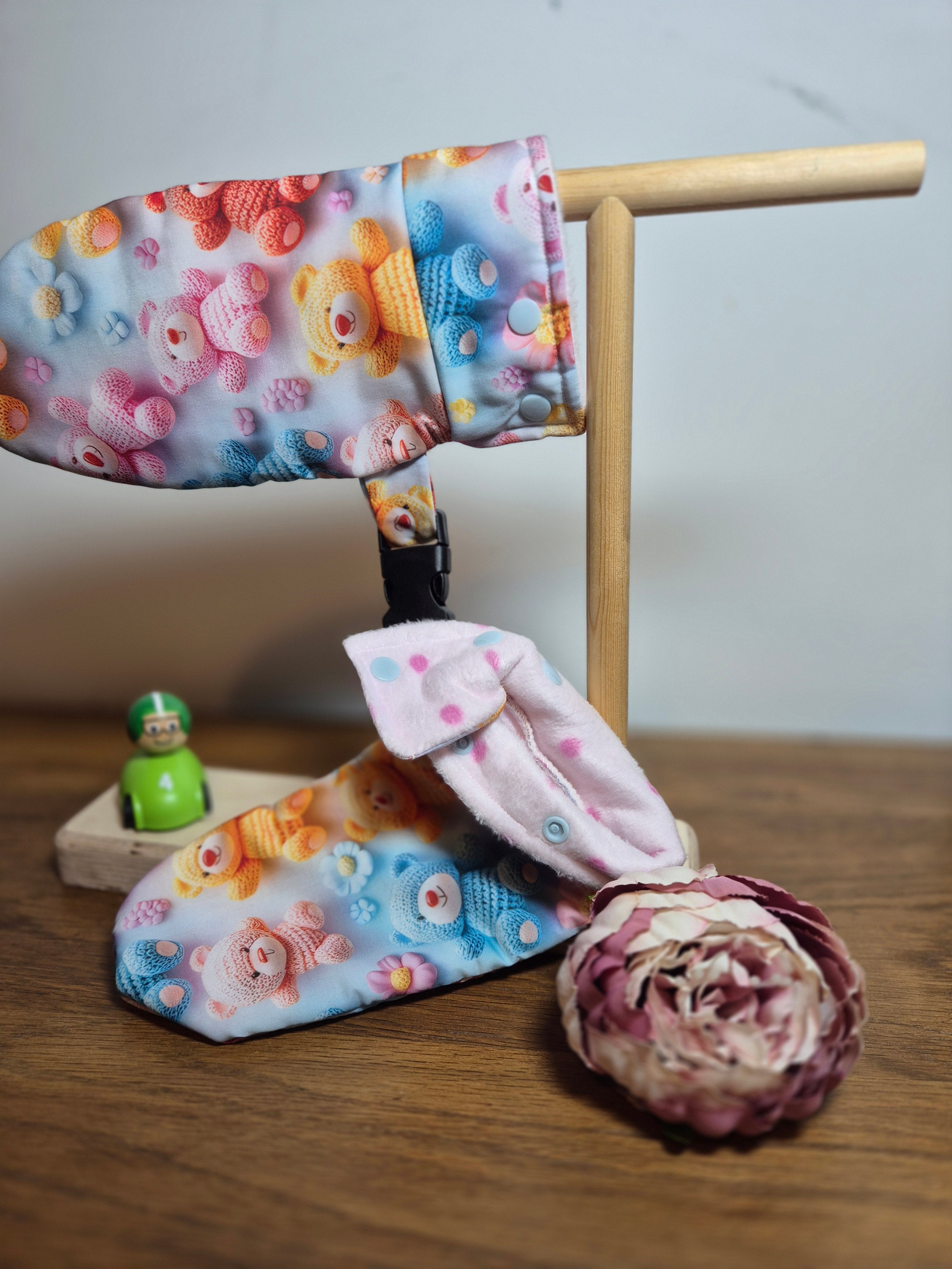 scratch mittens on stand, cuff peeled back to show inside fabric. 